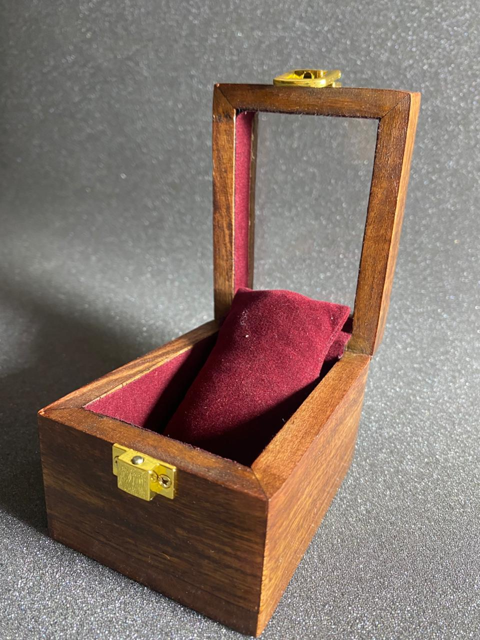 One-slot wooden watch box open, showing the velvet pillow inside