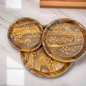 Elegant Brass Plate Set with Wooden Base – top view