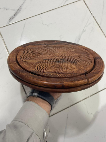 Side view of folded wooden dry fruit tray showing compact storage design