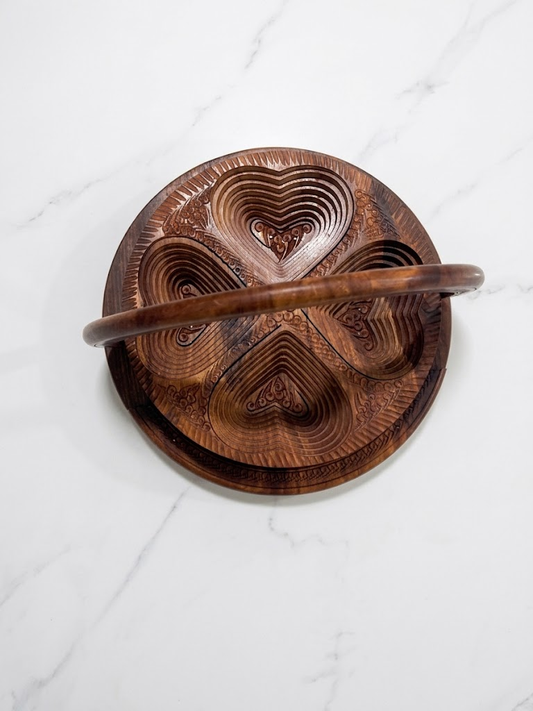 Top view of carved wooden dry fruit tray showing heart-shaped compartment design