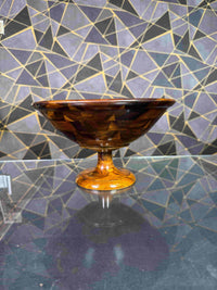 Side view of a wooden serving bowl with pedestal stand