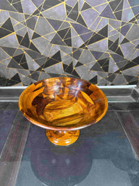 Polished wooden serving bowl with pedestal stand, viewed from above